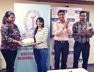 Presenting prize to the winner of Women's Day at WIRC office of ICMAI
